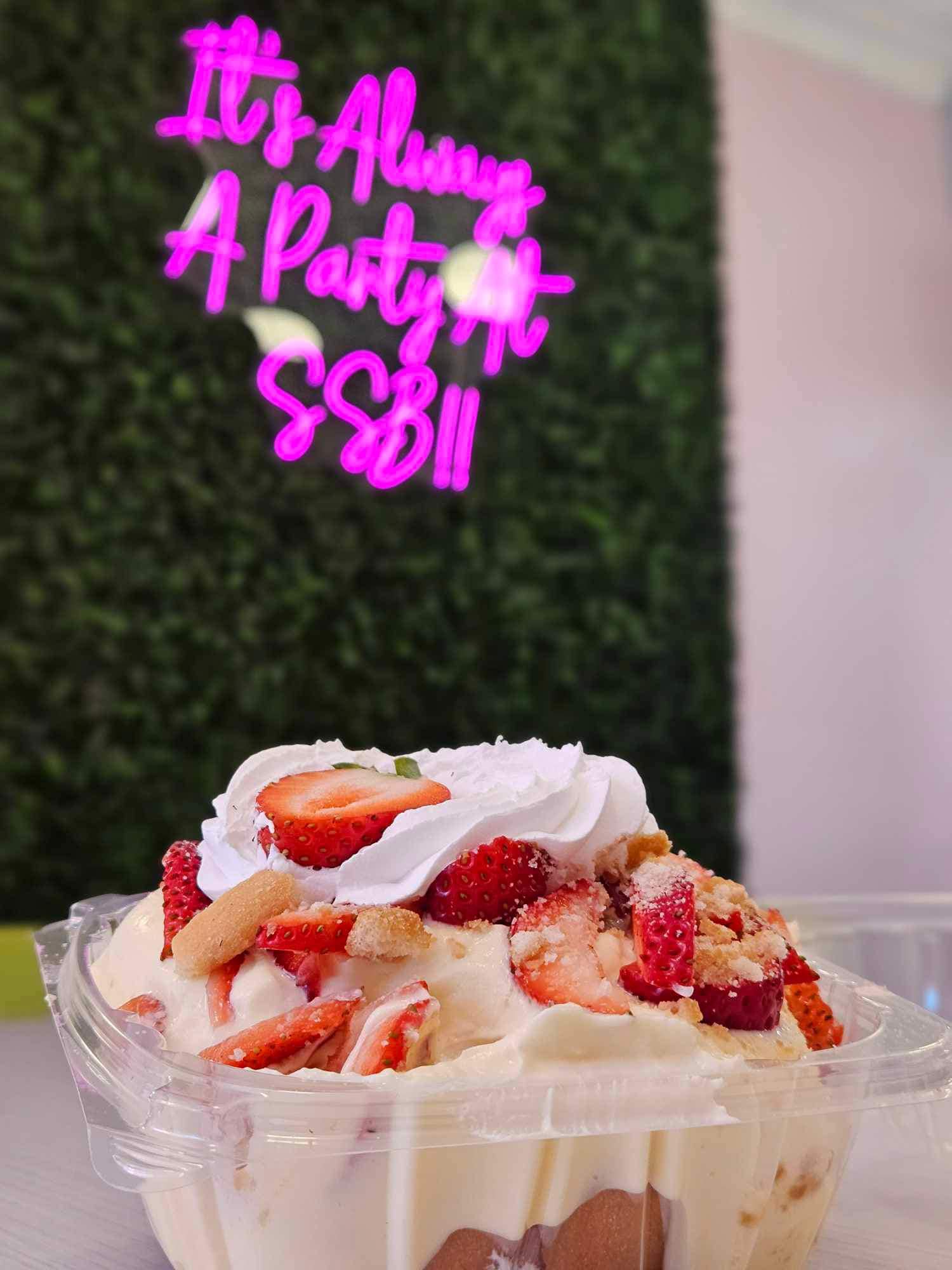 strawberry banana pudding sitting on table at simply sensational berries restaurant